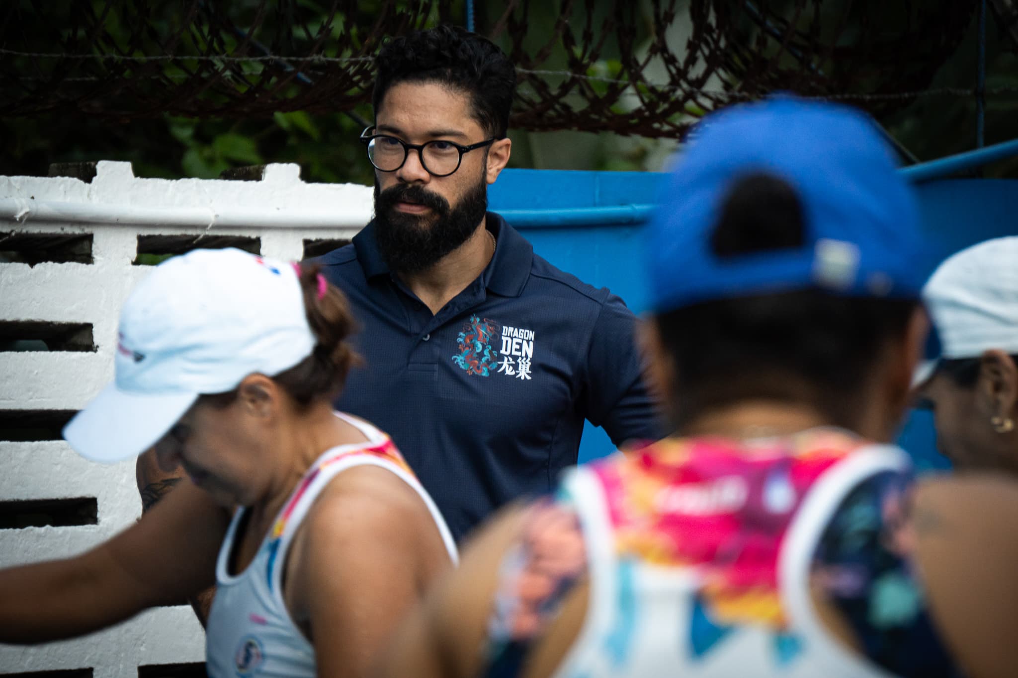 Coach observing Dragon Den athletes